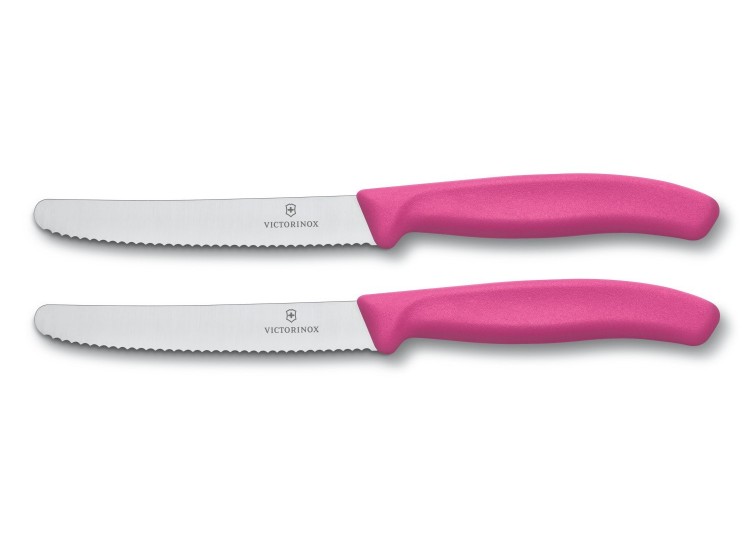 2 couteaux de table Victorinox lame 11cm &agrave; dents bout rond manche rose