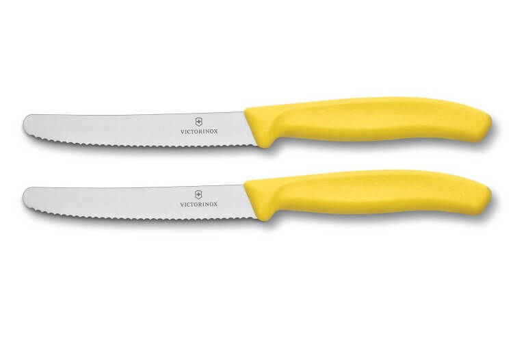 2 couteaux de table Victorinox lame 11cm à dents bout rond manche jaune