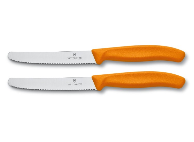 2 couteaux de table Victorinox lame 11cm &agrave; dents bout rond manche orange