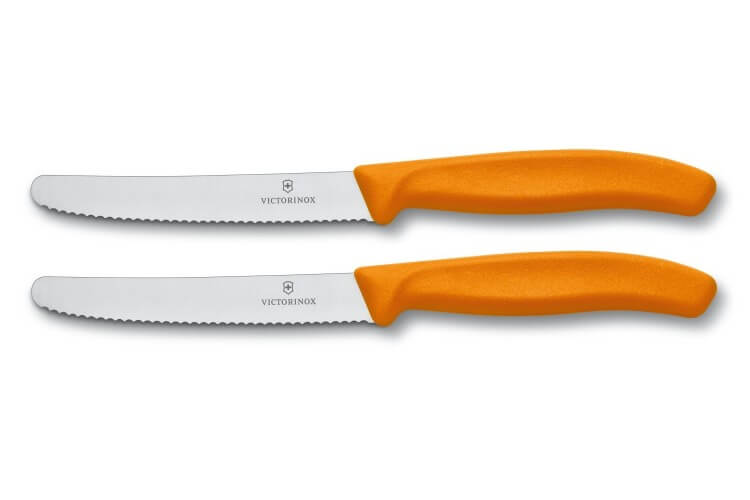2 couteaux de table Victorinox lame 11cm à dents bout rond manche orange